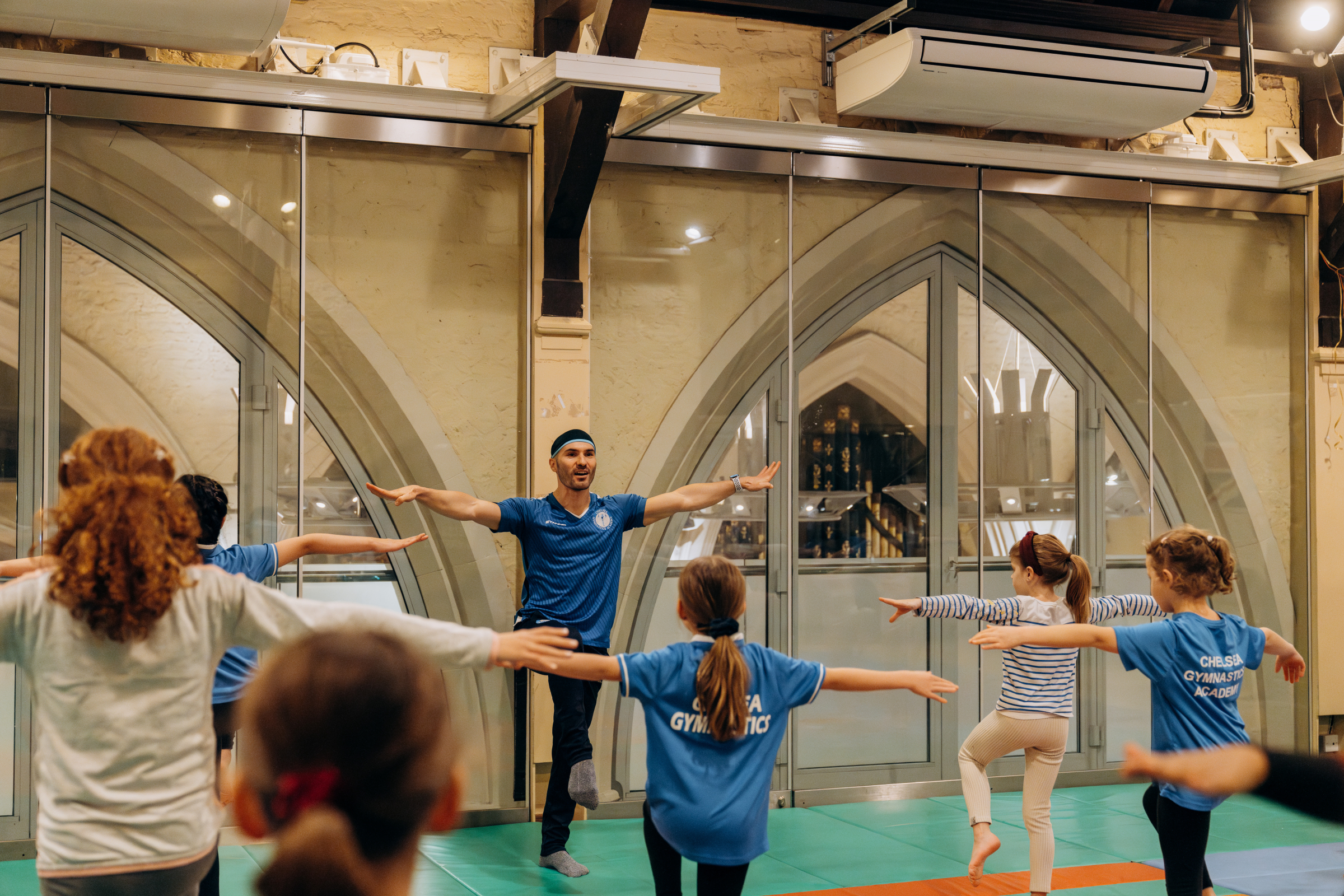 Coach Stefan teaching gymnastics at Chelsea Gymnastics Academy in Kensington London